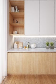 a kitchen with wooden cabinets and white counter tops, along with shelves filled with books