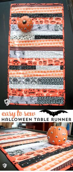 an orange and black table runner with pumpkins on it