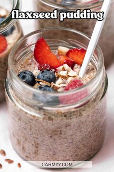 two jars filled with oatmeal and strawberries on top of each other