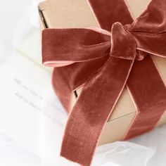 a wrapped present box with a ribbon on it