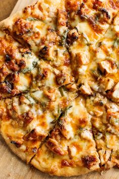 a pizza sitting on top of a wooden cutting board