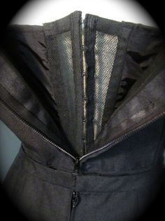 a black jacket with zippers on it