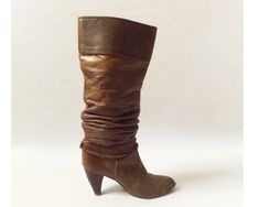 vintage 80s slouchy heeled boots.  muted brown color with faux alligator / animal pattern with braided rope around the foot portion.  3.5 inch heels.  pointed toes.  size 7.5 M on boots, see measurements for fit.   LABEL -- zodiac MATERIAL -- leather CONDITION -- great vintage -- scuff marks/nicks to back and inside of heels, sifting inside of boots as well.  see pictures. MEASUREMENTS IN INCHES size - 7.5 M on boot outer sole length back of heel to tip of toes -- 9 boot shaft length -- 14.5 width of foot -- 3 top opening -- 14 heel height -- 3.25 80s Boots, Slouchy Leather Boots, Hippie Rock, Muted Brown, Vintage Zodiac, 80s Look, Slouch Boots, Casual High Heels, Slouchy Boots