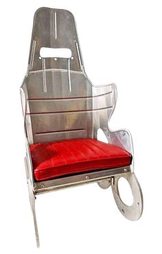 a metal chair with a red cushion on it