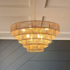 a chandelier hanging from the ceiling in a room