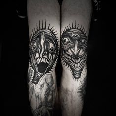 two men's legs with black and white tattoos on them, both showing their faces