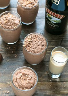 chocolate mousse in small glasses next to a bottle of bailey's