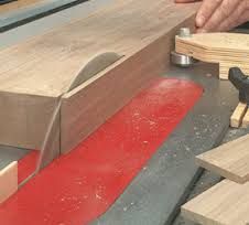 a person working with woodworking tools on a table