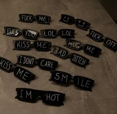 some black and white signs that say i'm hot, kiss me, lol,