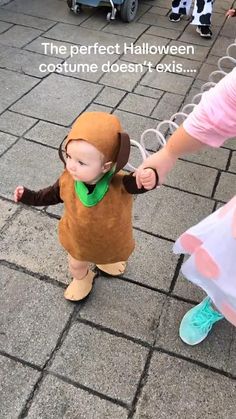 a baby dressed up as a monkey being held by someone's hand with the caption, the perfect halloween costume doesn't exist