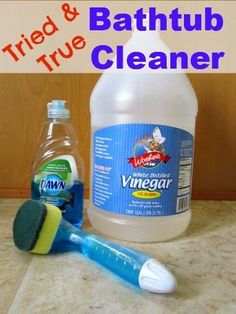 a bottle of vinegar and a toothbrush sitting on a counter with the words tried & bathtub cleaner next to it