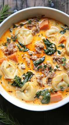 Creamy Sausage Tortellini Soup in a white bowl. Sausage Tortellini Soup Healthy, Keto Tortellini Soup, Soup Recipes In Crockpot, Sausage Tortellini Soup Crockpot, Creamy Sausage Soup, Soup Thanksgiving, Crockpot Tortellini Soup, Tortellini Soup Crockpot, Creamy Sausage Tortellini Soup