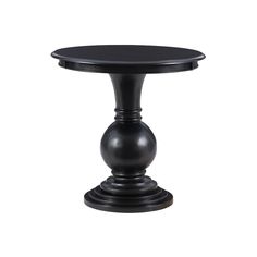 a small black table with an oval top on a white background ornament is placed at the base