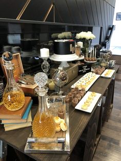 the table is covered with many different types of desserts and pastries on it