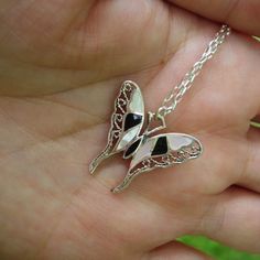 Mother Of Pearl And Black Onyx Inlaid In A Tiny Filigree Winged Butterfly Hanging From An 18 Inch Sterling Silver Chain. Both The Butterfly And The Chain Are Marked 925. New Without Tags Price Is Firm! The Butterfly Measures 15/16 Of An Inch Wide And 7/8 Of An Inch Tall. A Delicate And Slightly Wild Looking Butterfly! Black Butterfly-shaped Jewelry For Gift, Black Butterfly Jewelry For Gift, Handmade Black Butterfly Necklace, Black Butterfly Necklace For Gift, Handmade Black Butterfly Jewelry, Antique Illustration, Mother Pearl, Butterfly Necklace, Black Cream