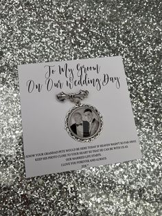 a keychain with an image of two people on it and the words, to my great our wedding day