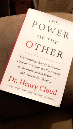 the power of the other by dr henry cloud book sitting on top of a couch