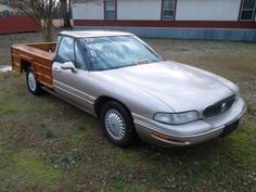 a silver car parked in front of a house