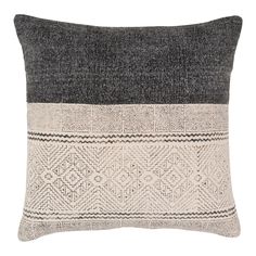 a black and white pillow with two different colors