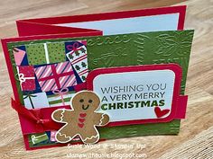 a close up of a christmas card with a gingerbread on the front and bottom