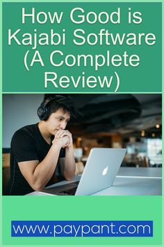 a man sitting in front of a laptop computer with headphones on his face and the words how good is kajabi software a complete review