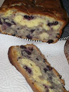 a loaf of blueberry bread sitting on top of a white towel