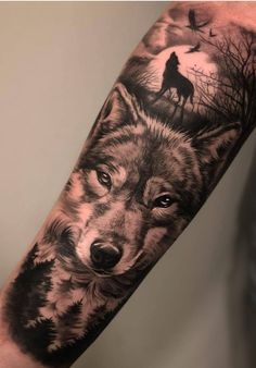 a man's arm with a wolf tattoo on it