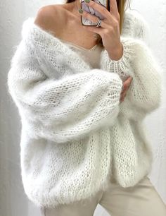 "White mohair cardigan.  Fluffy mohair cardigan for cozy outfit. The material of this cardigan consists of mohair, wool and acrylic.                                                                                                                            Color on the photo : White #55,Creame # 01, Light Beige # 67, Purple # 10.                                                                                                                                                                                   This yarn is super soft , trender, warm and comfortable.                                                        100 % Hand Made.                              For XS-S Length 21\" - 55 cm Width 18\" - 46 cm.                                                                                For M Fluffy Sweater Outfit, Pull Mohair, Fluffy Cardigan, Soft Knit Cardigan, White Knit Cardigan, Pull Oversize, Cardigan Oversized, Mohair Knit, Mohair Cardigan