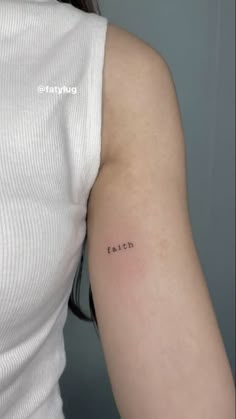 a woman with a small tattoo on her arm