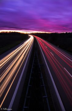 long exposure shot of traffic on highway at dusk