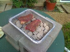 some meat is sitting on top of some rocks