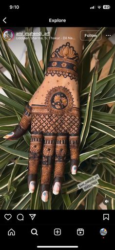 the hand is decorated with henna on it