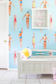 a child's room with wallpaper and toys