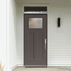 the front door of a house with white siding