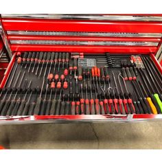 a red toolbox filled with lots of tools