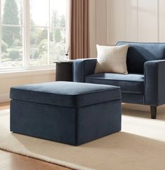 a living room with a blue chair and ottoman