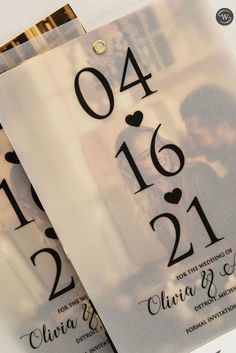 wedding save the date cards with hearts and numbers on them are displayed in front of each other