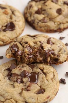 chocolate chip cookies are stacked on top of each other