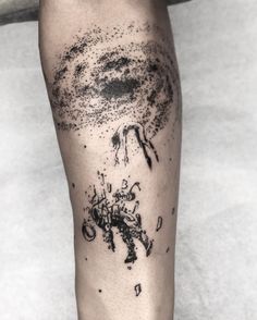 a man's leg with black ink on it