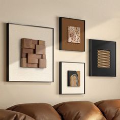 a living room filled with brown furniture and pictures on the wall above it's headboard