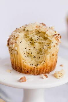 a muffin is sitting on a white plate