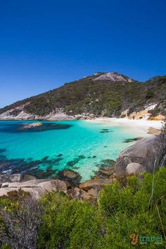 the water is crystal blue and clear at this beach in australia's great barrier