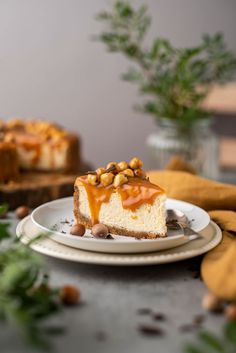 a piece of cheesecake on a plate with nuts