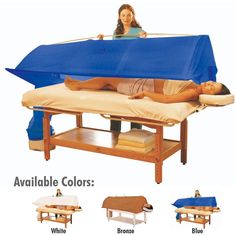 a woman laying on top of a bed under a blue cover