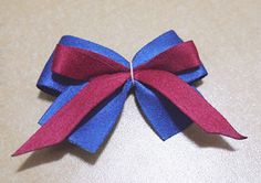 a red and blue bow on top of a table