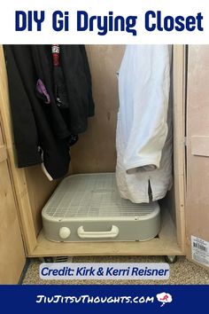 the inside of a closet with clothes hanging on it