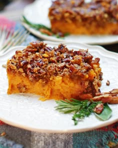 two white plates topped with slices of pecan pie on top of a wooden table