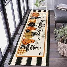 a halloween themed runner rug with pumpkins and jack - o'- lanterns