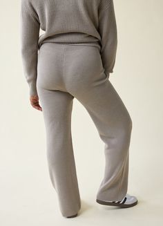 Let’s get cozy. These laid-back maternity pants feature drapey wide legs and the softest, snuggliest sweater knit you’ve ever felt. Done with a mid-rise, elastic waist that stretches with your bump without digging in, these pants are the kind of comfy you’ll never want to take off. Top with the matching Cozy Quarter Zip Sweater or your favorite blouses or button-ups — they can be dressed up or down.  Ribbed sweater knit: mid-weight and super comfortable  Stretch level: high  50% polyester, 50% acrylic  Machine was cold, gentle cycle. Wash inside out and separately. Reshape and dry flat in shade. Cool iron if needed. Do not bleach or dry clean. Fits from 1st to 4th trimester  Mid-rise covered elastic waistband  Wide-leg fit (inseam: 28 ¼”)  Works on sizes 0 to 18  We recommend choosing your Cozy Knit Sweater, Quarter Zip Sweater, Maternity Pants, Cozy Chic, Sweater Pants, Wide Legs, Softest Sweater, Stay Cozy, Sweater Knit