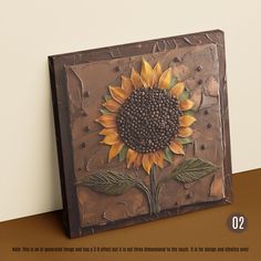 a metal plaque with a sunflower painted on it